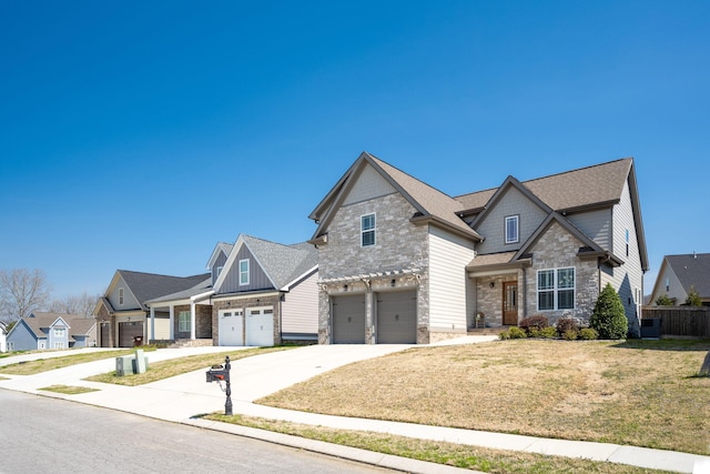 8975 Silver Maple Dr, Ooltewah, TN 37363 - craftsman inspired home with driveway, stone siding, an attached garage, a front lawn, and a residential view