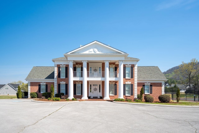 8975 Silver Maple Dr, Ooltewah, TN 37363 - view of building exterior with uncovered parking and fence