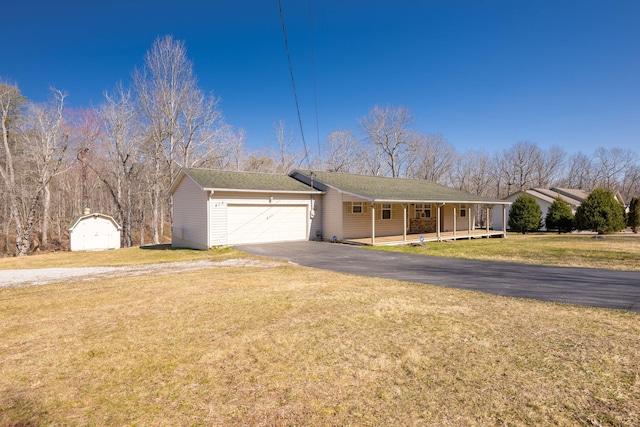 ranch-style house with a garage, a storage shed, a front lawn, aphalt driveway, and a porch