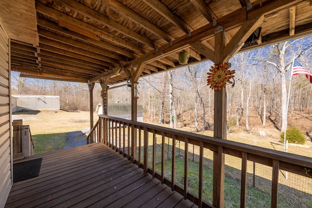 wooden terrace with an outbuilding