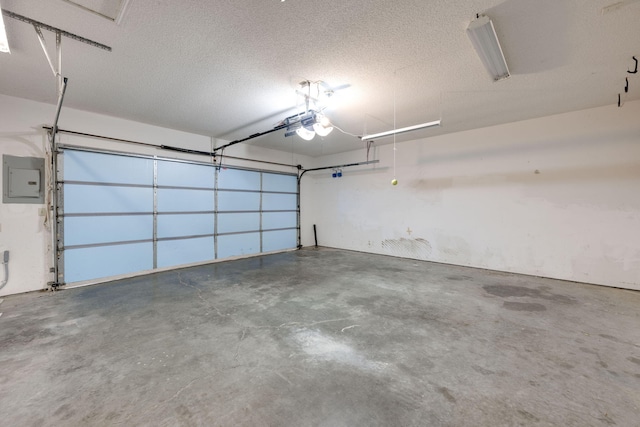 garage featuring electric panel and a garage door opener