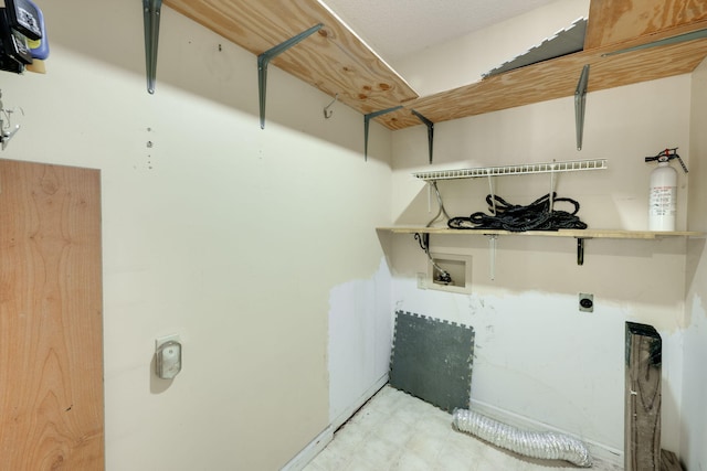 laundry area with light floors, electric dryer hookup, laundry area, and washer hookup