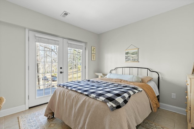 bedroom with multiple windows, light tile patterned flooring, access to exterior, and visible vents