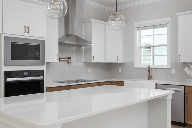 kitchen with oven, black electric stovetop, built in microwave, wall chimney range hood, and stainless steel dishwasher