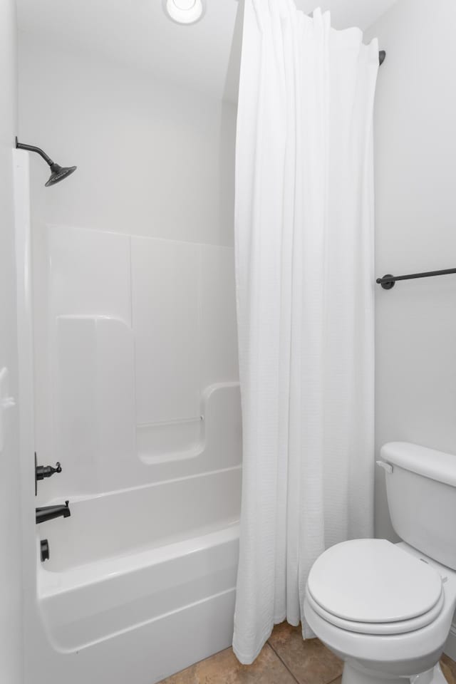 full bathroom with toilet and shower / tub combo with curtain