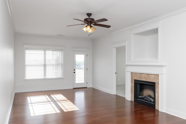 unfurnished living room featuring a ceiling fan, wood finished floors, and crown molding
