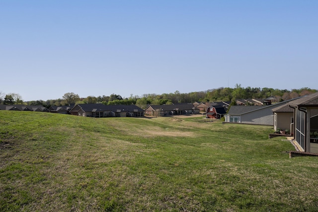view of yard featuring a residential view