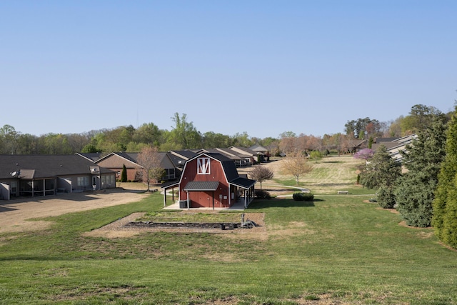 view of yard with an outbuilding and a barn