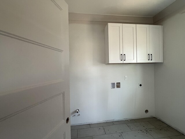 581 Benson Dr, Chattanooga, TN 37412 - laundry room featuring electric dryer hookup, cabinet space, gas dryer hookup, and hookup for a washing machine