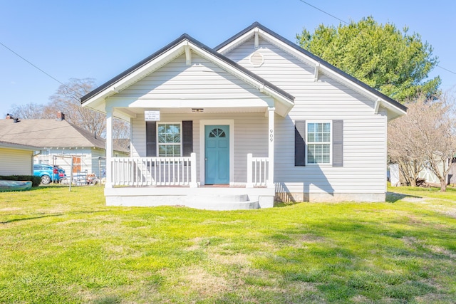 909 Stewart Ave, Chickamauga, GA 30707 - bungalow-style house with a porch and a front lawn