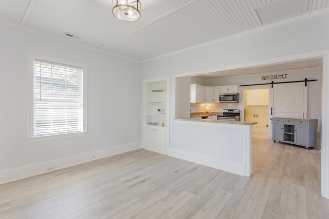 909 Stewart Ave, Chickamauga, GA 30707 - kitchen with light wood-type flooring, ornamental molding, baseboards, visible vents, and appliances with stainless steel finishes