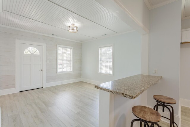 909 Stewart Ave, Chickamauga, GA 30707 - entryway with light wood finished floors, baseboards, crown molding, and wood ceiling