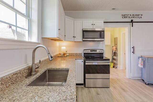 909 Stewart Ave, Chickamauga, GA 30707 - kitchen featuring ornamental molding, a sink, white cabinets, light stone countertops, and appliances with stainless steel finishes