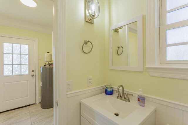 909 Stewart Ave, Chickamauga, GA 30707 - bathroom featuring vanity, crown molding, and wainscoting