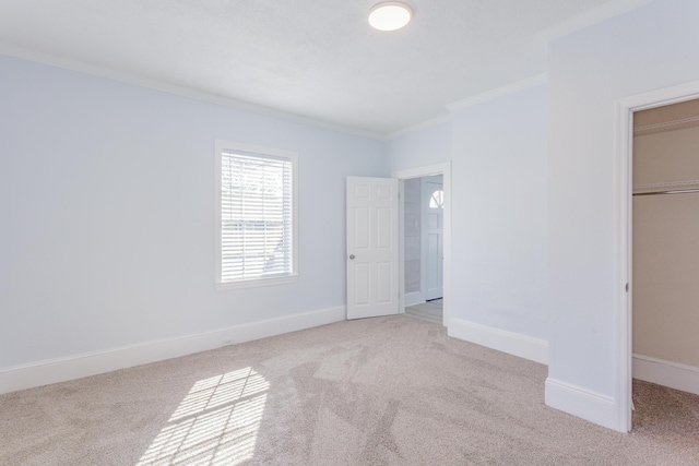 909 Stewart Ave, Chickamauga, GA 30707 - unfurnished bedroom featuring light carpet, baseboards, a walk in closet, and ornamental molding