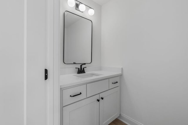 bathroom featuring vanity and baseboards