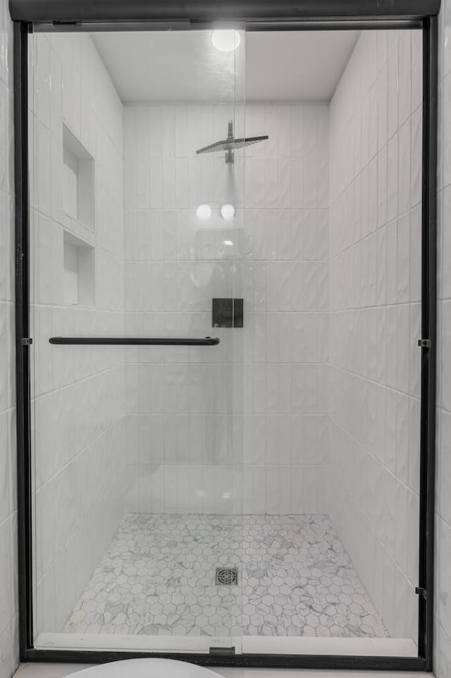 bathroom featuring a stall shower