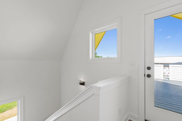 doorway featuring lofted ceiling