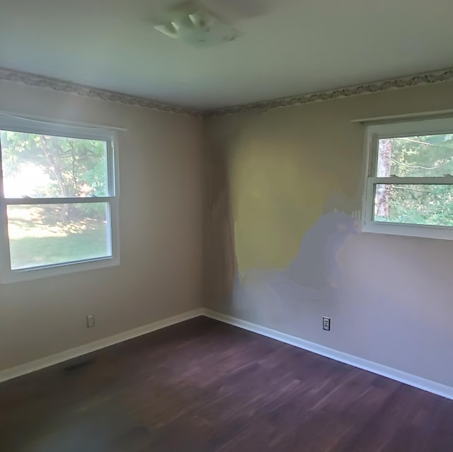 1603 Lisa Lynn Dr, Hixson, TN 37343 - unfurnished room with healthy amount of natural light and dark wood-style floors
