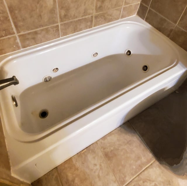 1603 Lisa Lynn Dr, Hixson, TN 37343 - bathroom featuring a jetted tub and tile patterned floors
