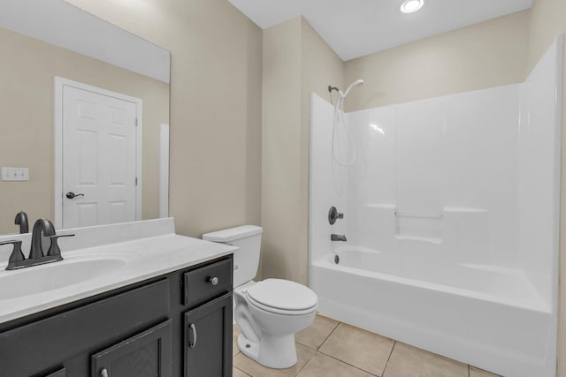 full bathroom with tile patterned flooring,  shower combination, toilet, and vanity