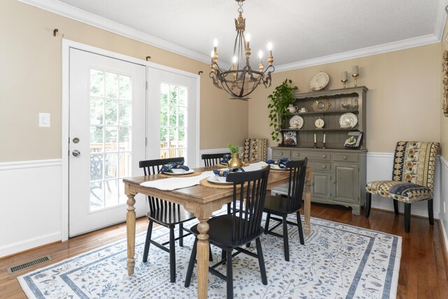 9215 Smokewood Trl, Chattanooga, TN 37421 - dining space with a chandelier, ornamental molding, and wood finished floors