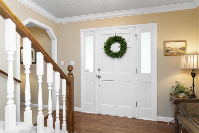 9215 Smokewood Trl, Chattanooga, TN 37421 - foyer with wood finished floors, crown molding, stairway, and a textured ceiling