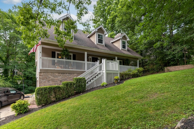 9215 Smokewood Trl, Chattanooga, TN 37421 - cape cod home featuring a porch, a front yard, and stairs
