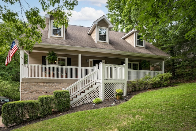 9215 Smokewood Trl, Chattanooga, TN 37421 - new england style home with covered porch, a front lawn, and roof with shingles