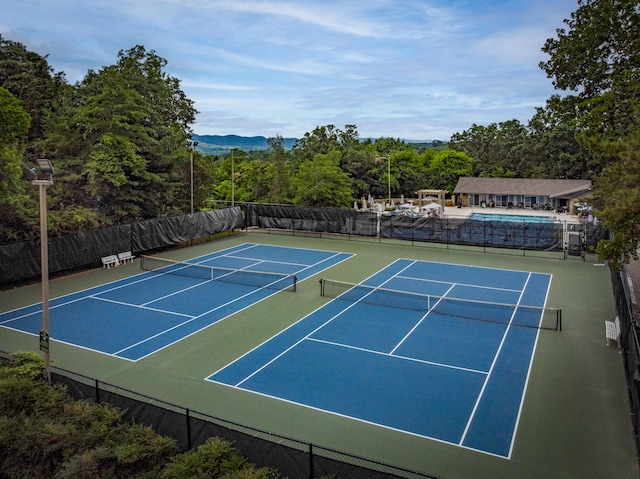 9215 Smokewood Trl, Chattanooga, TN 37421 - view of tennis court with community basketball court and a view of trees