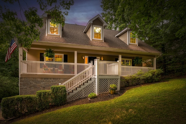 9215 Smokewood Trl, Chattanooga, TN 37421 - cape cod-style house with a porch, a front yard, and stairway