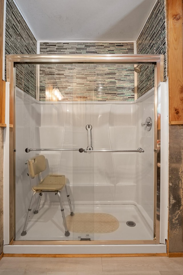 full bathroom featuring a shower stall