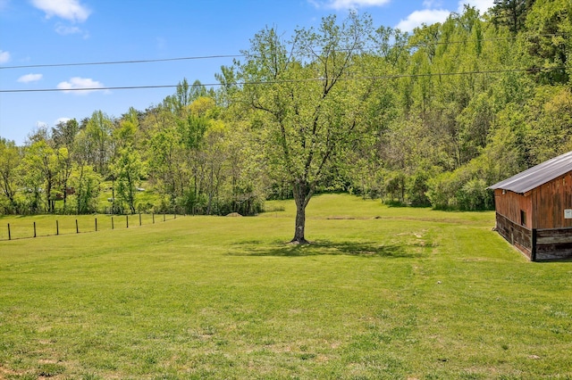 view of yard with a wooded view