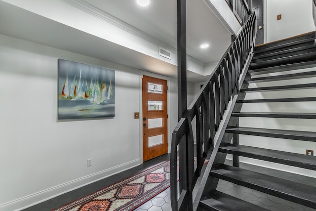 stairway featuring baseboards, visible vents, and recessed lighting