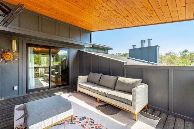 wooden deck with an outdoor hangout area