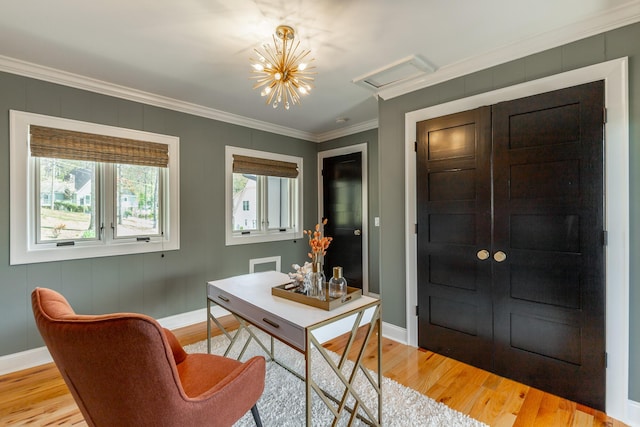 office with baseboards, ornamental molding, and light wood finished floors
