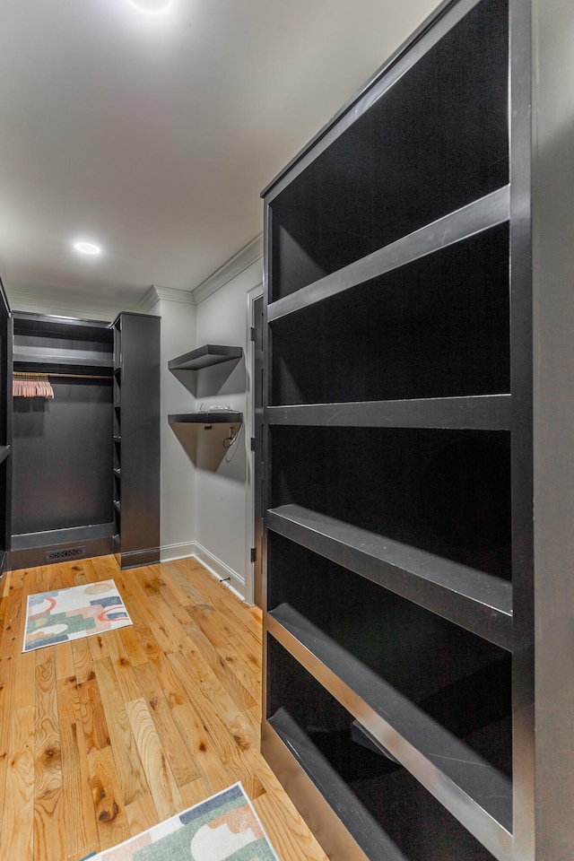 spacious closet featuring wood finished floors