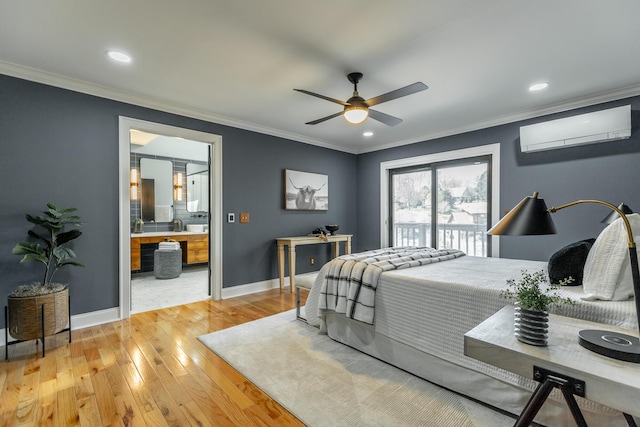 bedroom featuring a wall mounted AC, crown molding, light wood finished floors, baseboards, and access to exterior