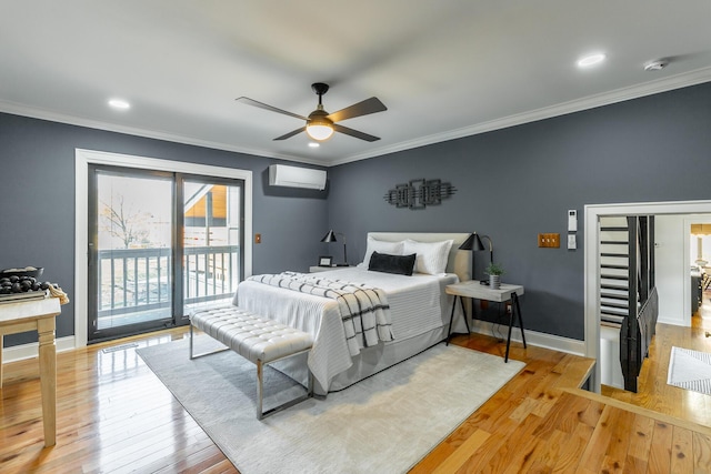 bedroom featuring ornamental molding, access to outside, a wall unit AC, and light wood finished floors