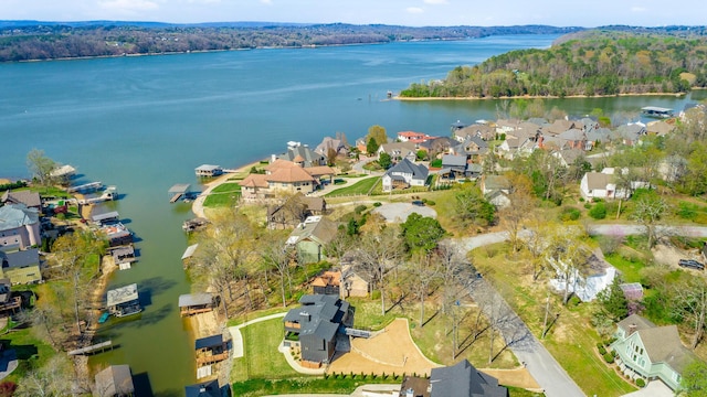 aerial view featuring a residential view, a water view, and a forest view