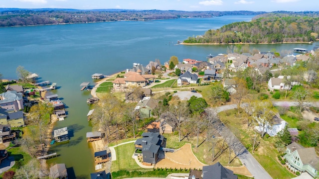 bird's eye view featuring a water view, a wooded view, and a residential view