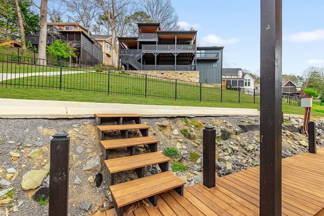 dock area with a lawn and fence