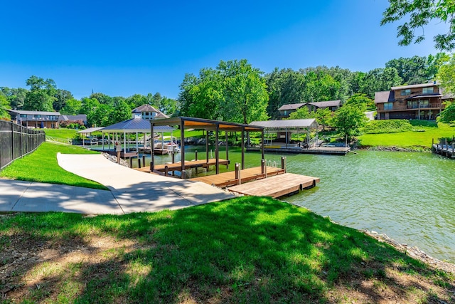 4910 Shoreline Dr, Chattanooga, TN 37416 - dock area featuring boat lift, a water view, and a lawn