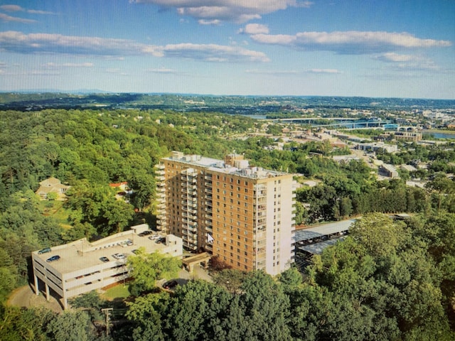 aerial view featuring a wooded view
