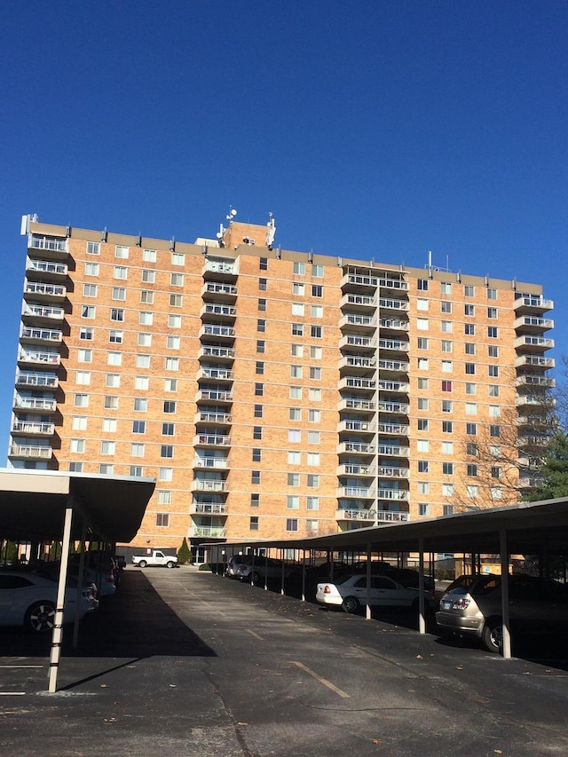 view of property featuring covered parking