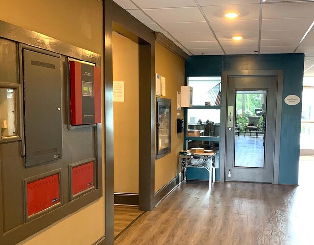 interior space featuring baseboards and wood finished floors