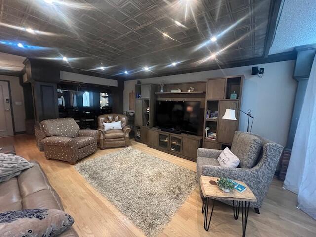 living area with wood finished floors