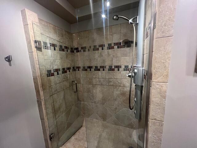 full bathroom featuring a stall shower