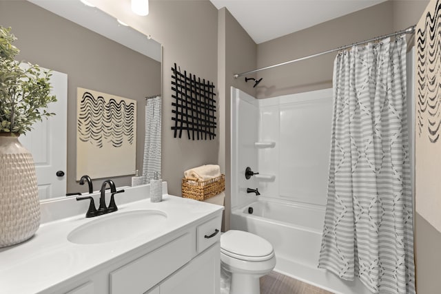 full bath with toilet, shower / bathtub combination with curtain, and vanity