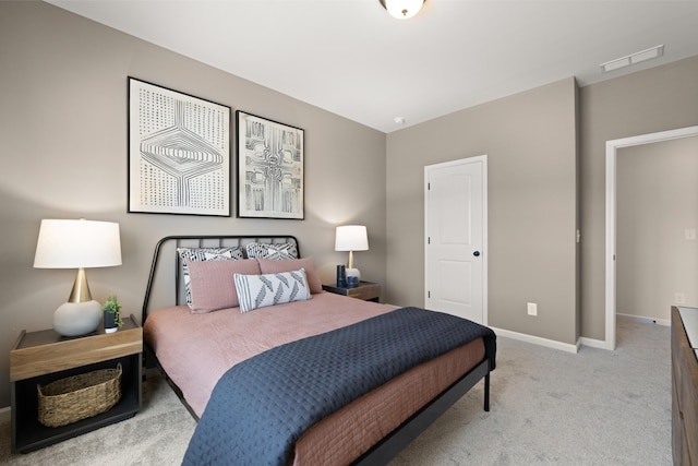 bedroom featuring baseboards, light colored carpet, and visible vents